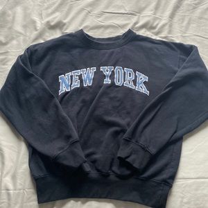 sweatshirt, color- dark blue with white fonts, authentic NYC merchandise